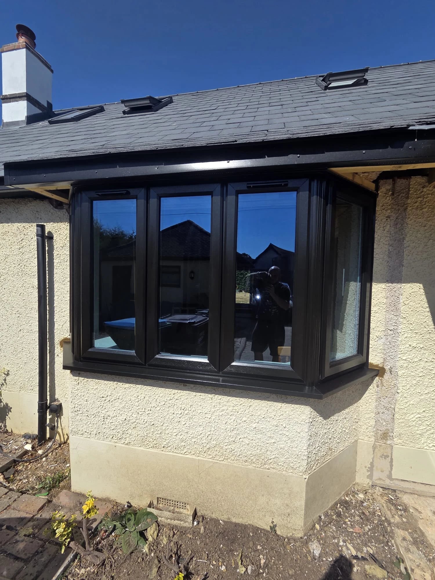 The same bay from the other side, tying into the black fascia above