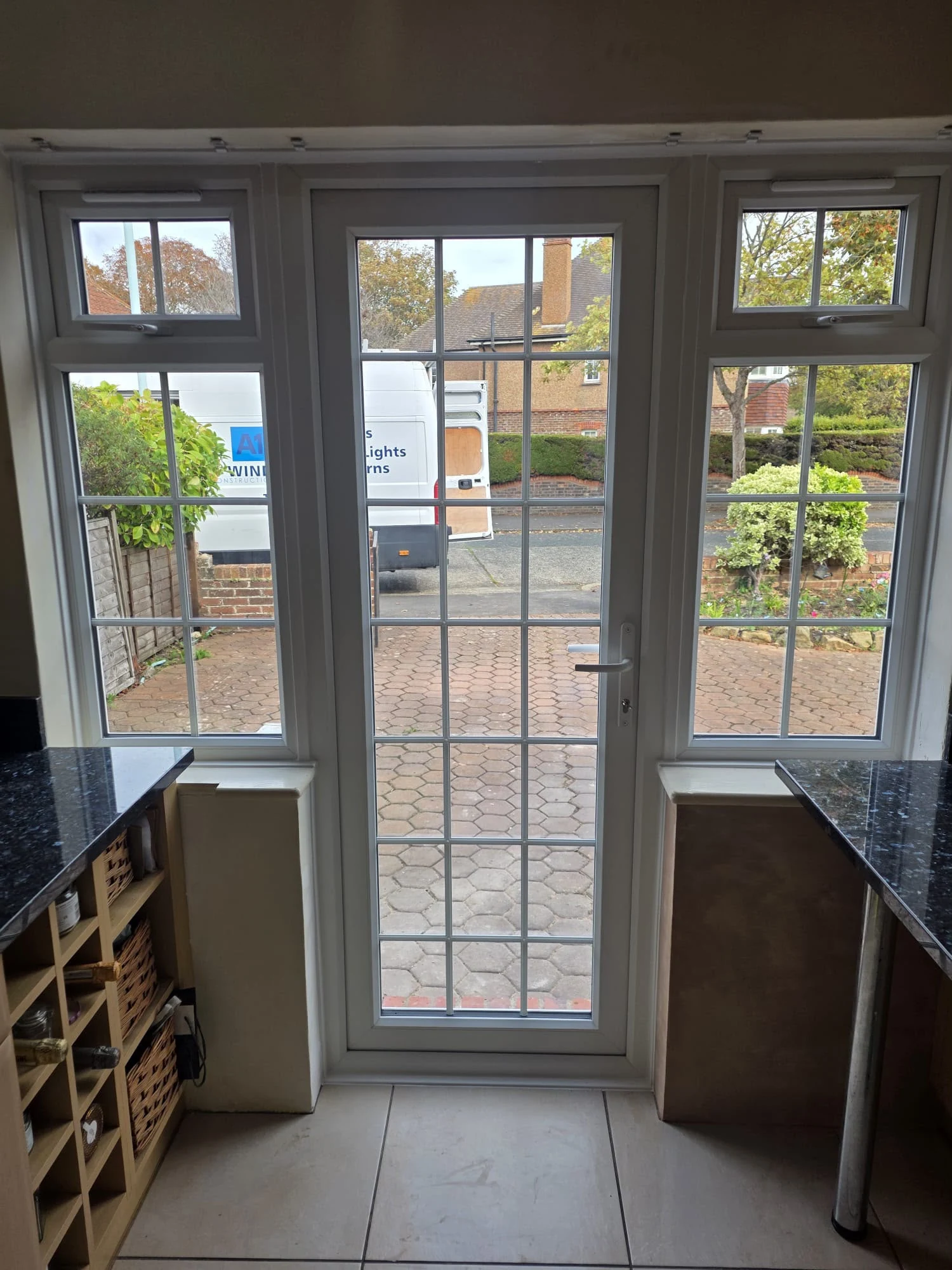 From inside the kitchen, looking out down the drive