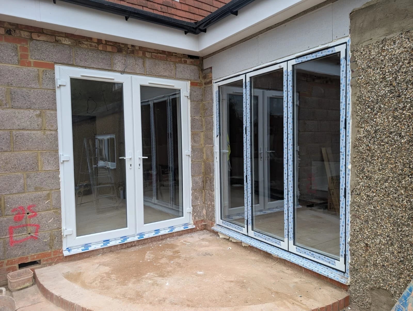 Both openings on the new extension: French doors on one wall, bi-folds on the corner