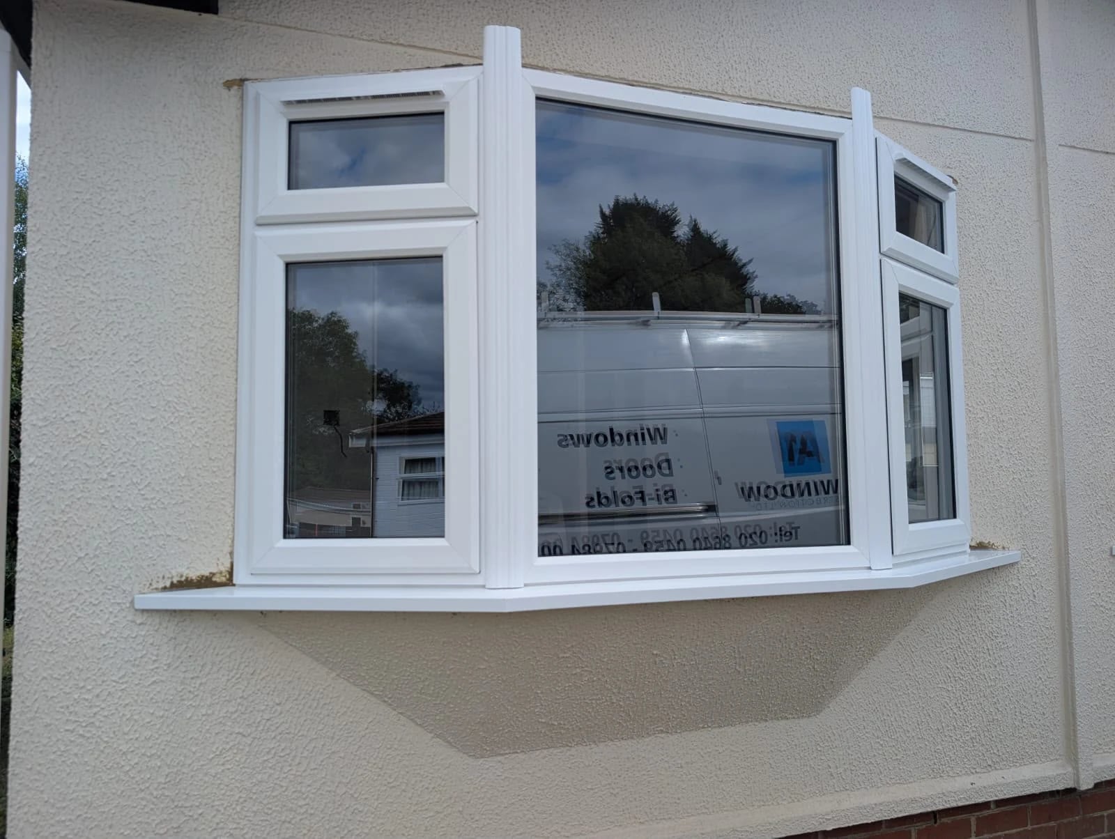 Bay window with a large fixed centre pane and opening side lights