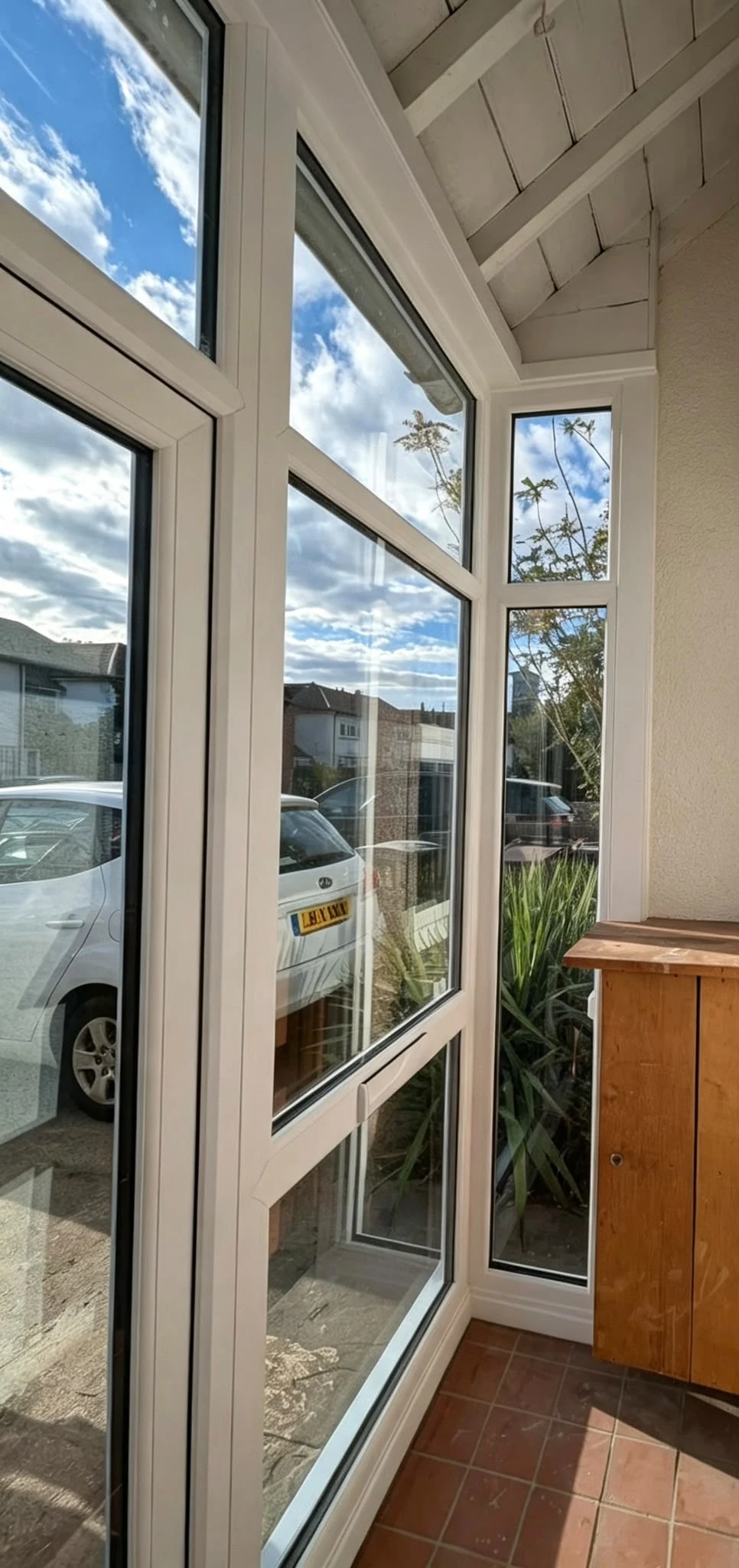 Inside the porch, a bright entrance space looking out to the street
