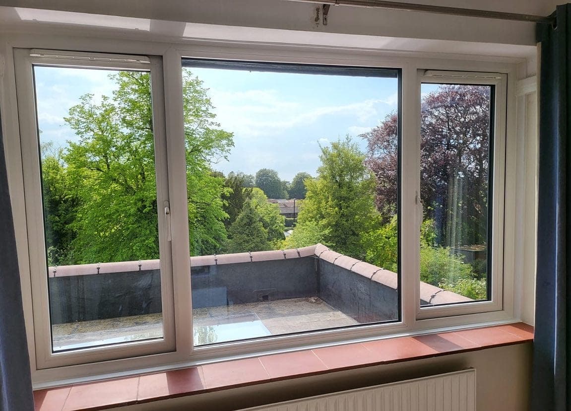 White UPVC casement windows, Surrey garden view