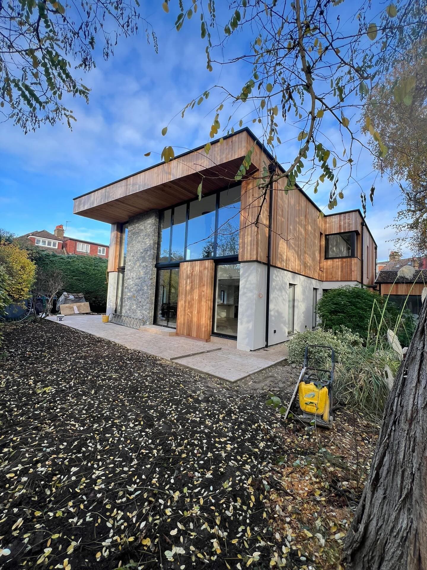 Contemporary corner glazing on new build extension — Surrey, aluminium windows by A1 Window Construction Ltd