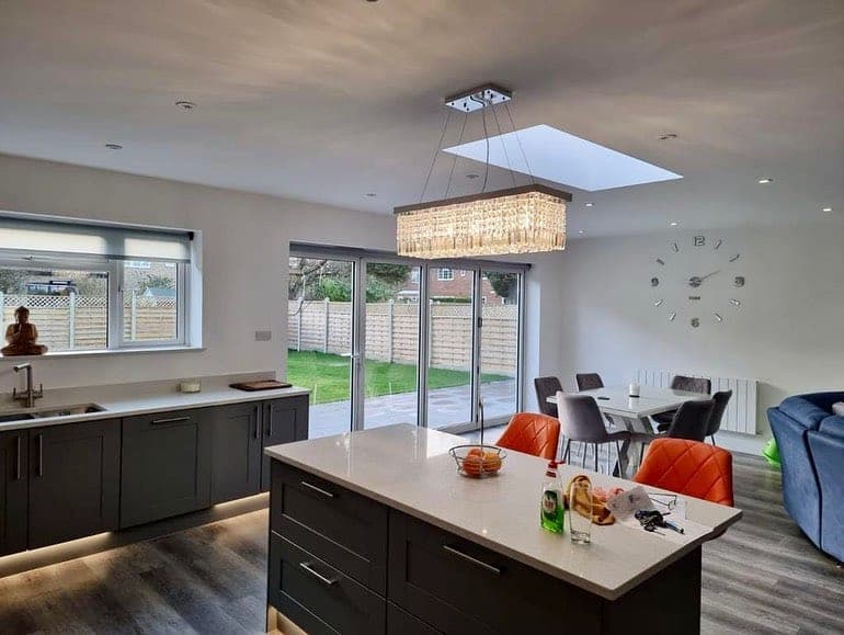 Kitchen extension with aluminium bi-fold doors and roof lantern — Surrey, by A1 Window Construction Ltd