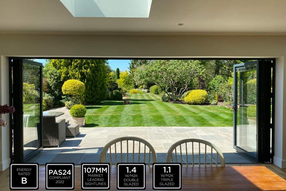 Aluminium bi-fold doors open to garden Cheam Sutton Surrey — A1 Window Construction Ltd